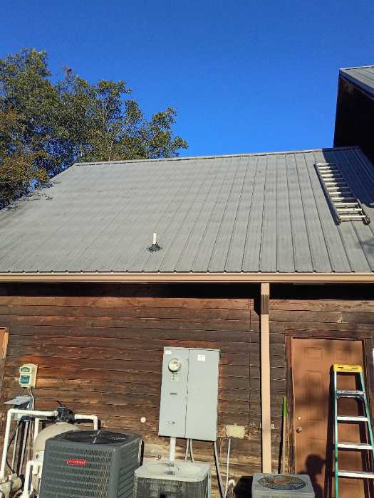 Replacing all the screws in a metal roof in Raymond, MS
