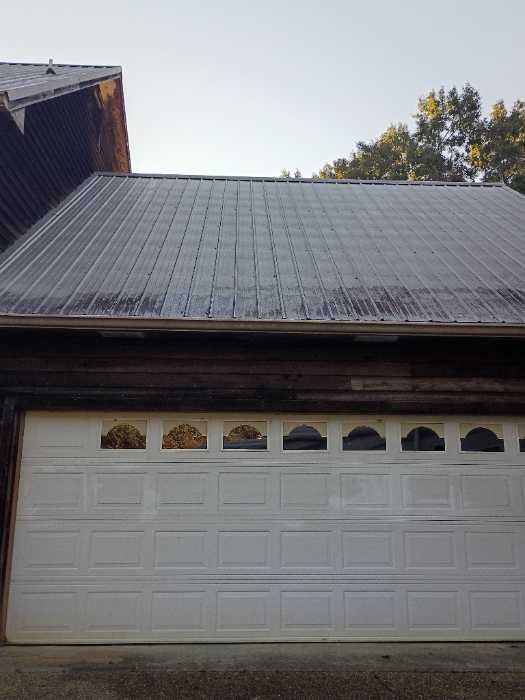 Replacing all the screws in a metal roof in Raymond, MS, photo 3