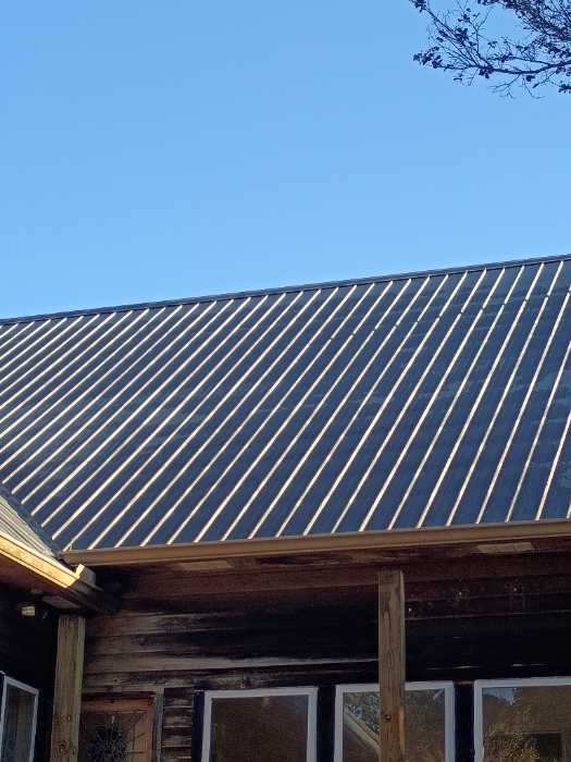 Replacing all the screws in a metal roof in Raymond, MS, photo 5
