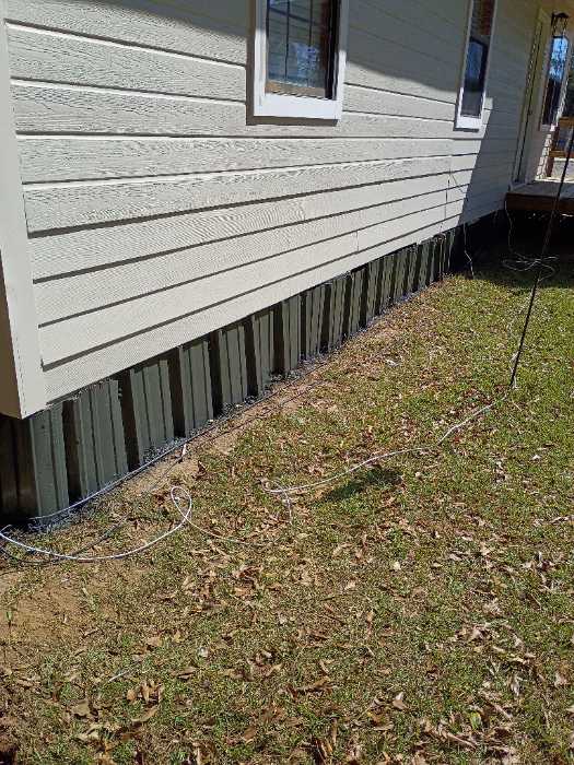 Painting the metal around the bottom of the house with DTM paint in Brandon, MS, photo 2