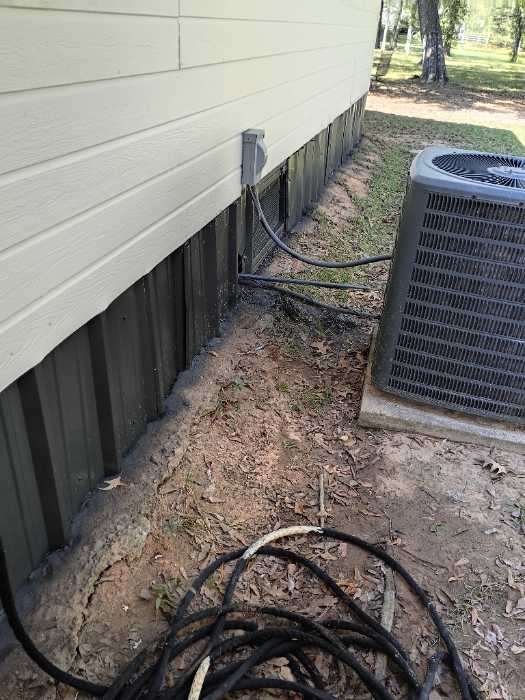 Painting the metal around the bottom of the house with DTM paint in Brandon, MS, photo 4