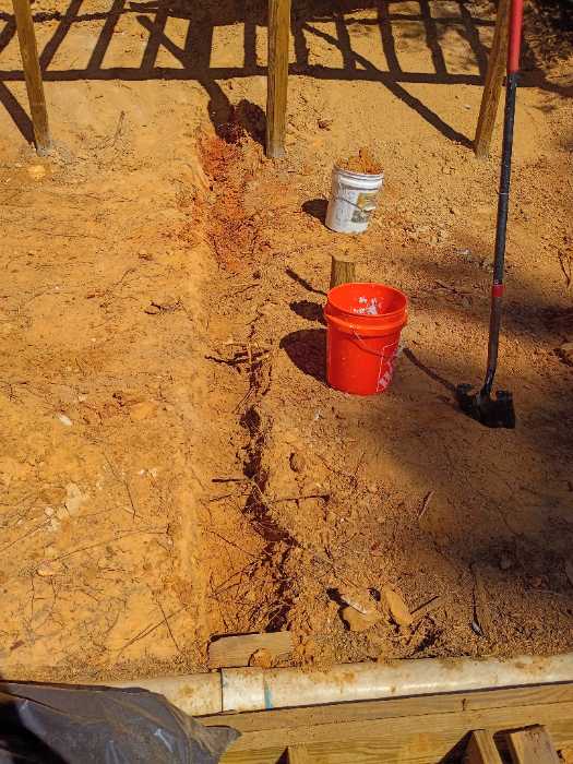 Building up dirt digging trenches so we can connect plumbing in Raymond, MS, photo 2