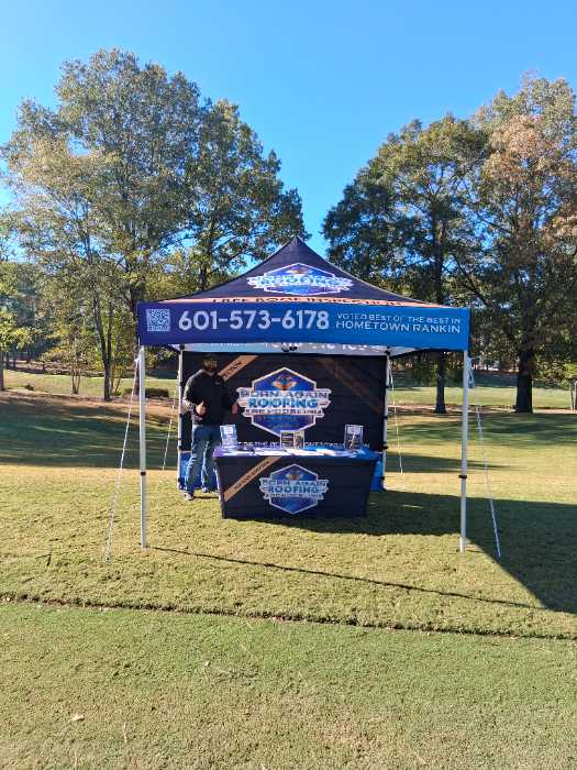 Setting up booth for fundraiser in Madison, MS