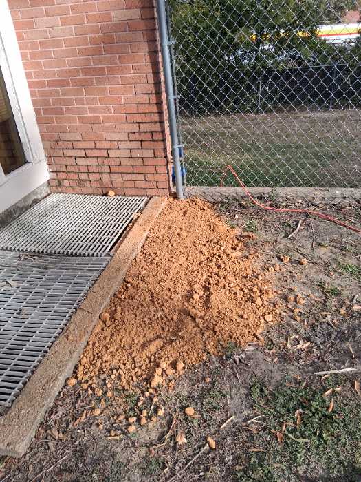 Repair concrete filling holes with dirt in Jackson, MS