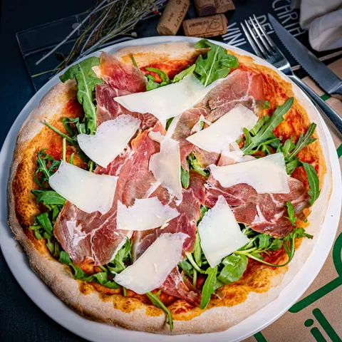 Pizza Ricca at Il Forno, Street 302 — wood-fired from a family-owned kitchen