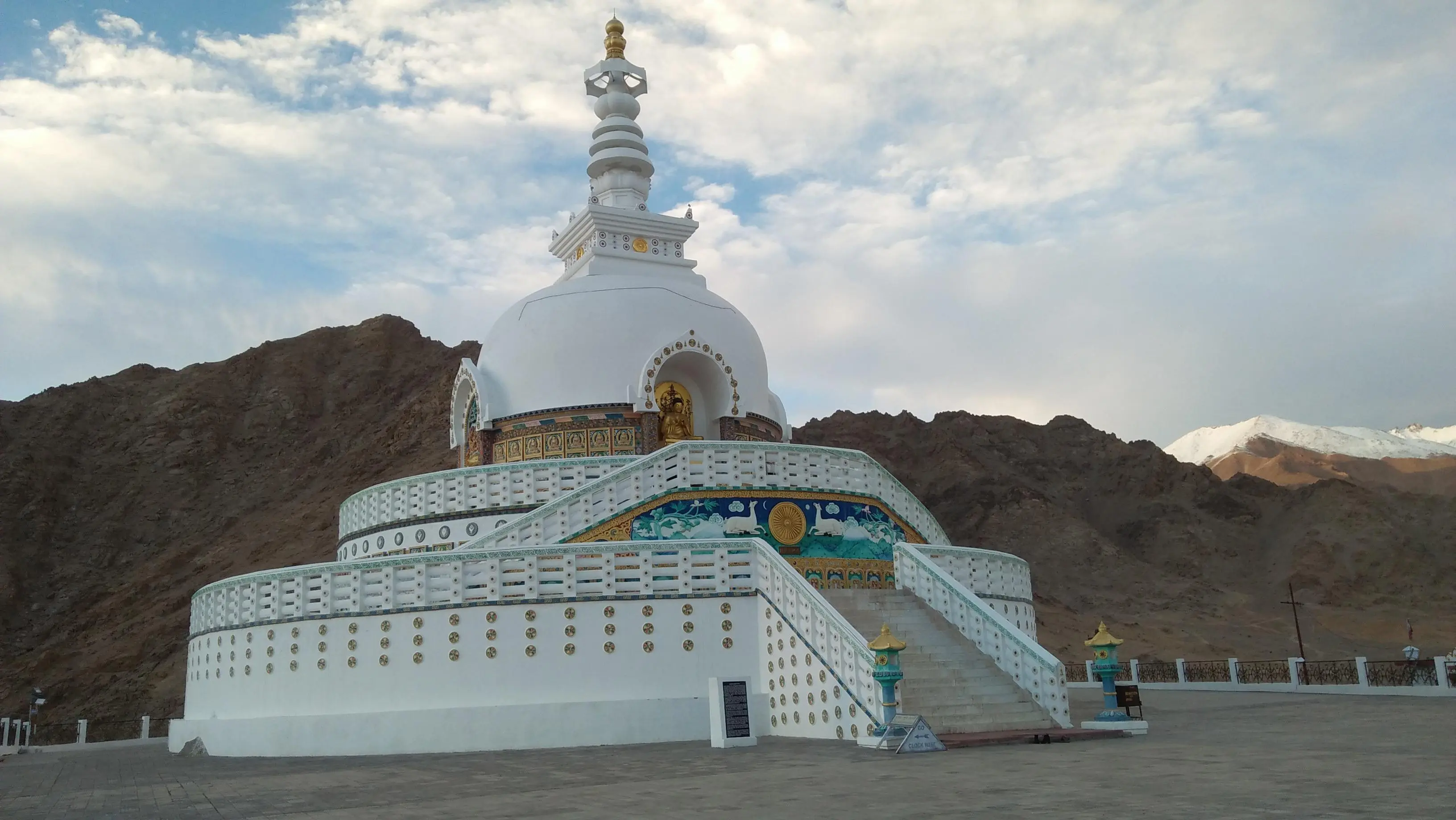 Shanti Stupa in Leh Ladakh with panoramic sunrise views, white dome structure and surrounding Himalayan mountains