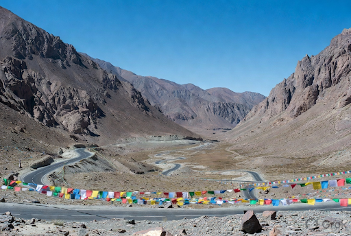 Khardung La Pass with colorful prayer flags on the road to Nubra Valley Ladakh