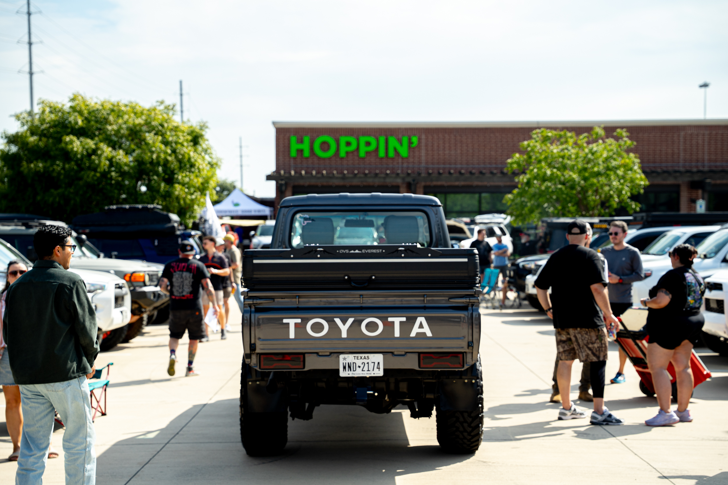 Toyota pickup parked in front of Hoppin' Grapevine at Toyotas & Taps