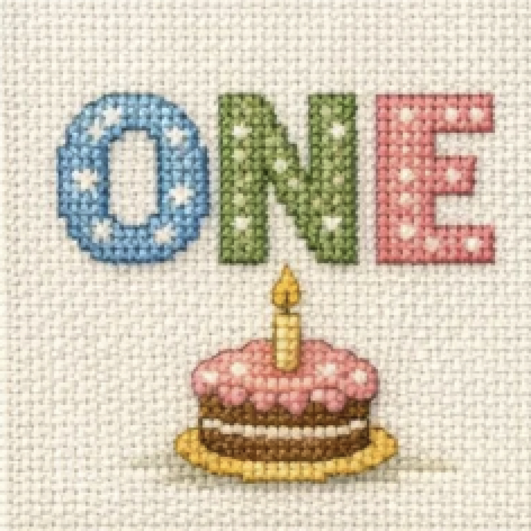 First birthday cake rendered as a cross stitch pattern