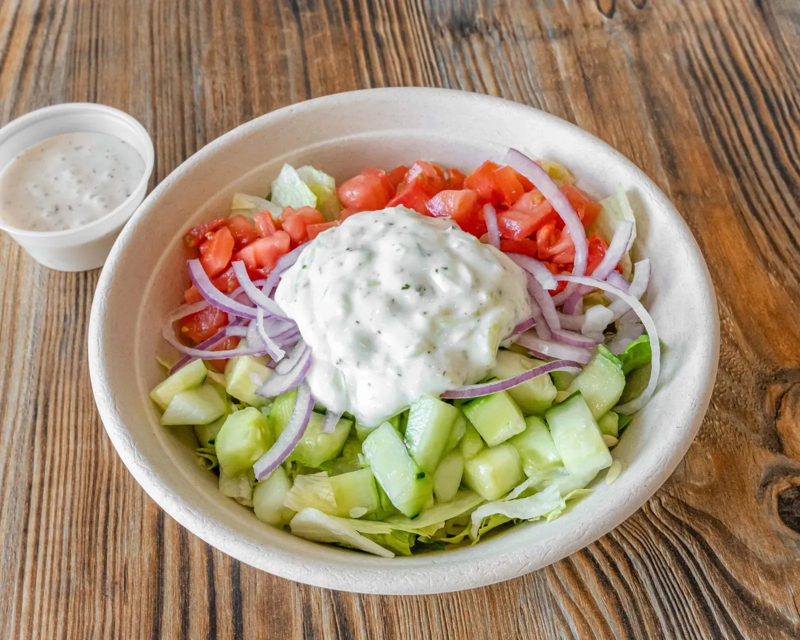 Pita Salad with lettuce, cucumber, tomato, red onion and a scoop of tzatziki