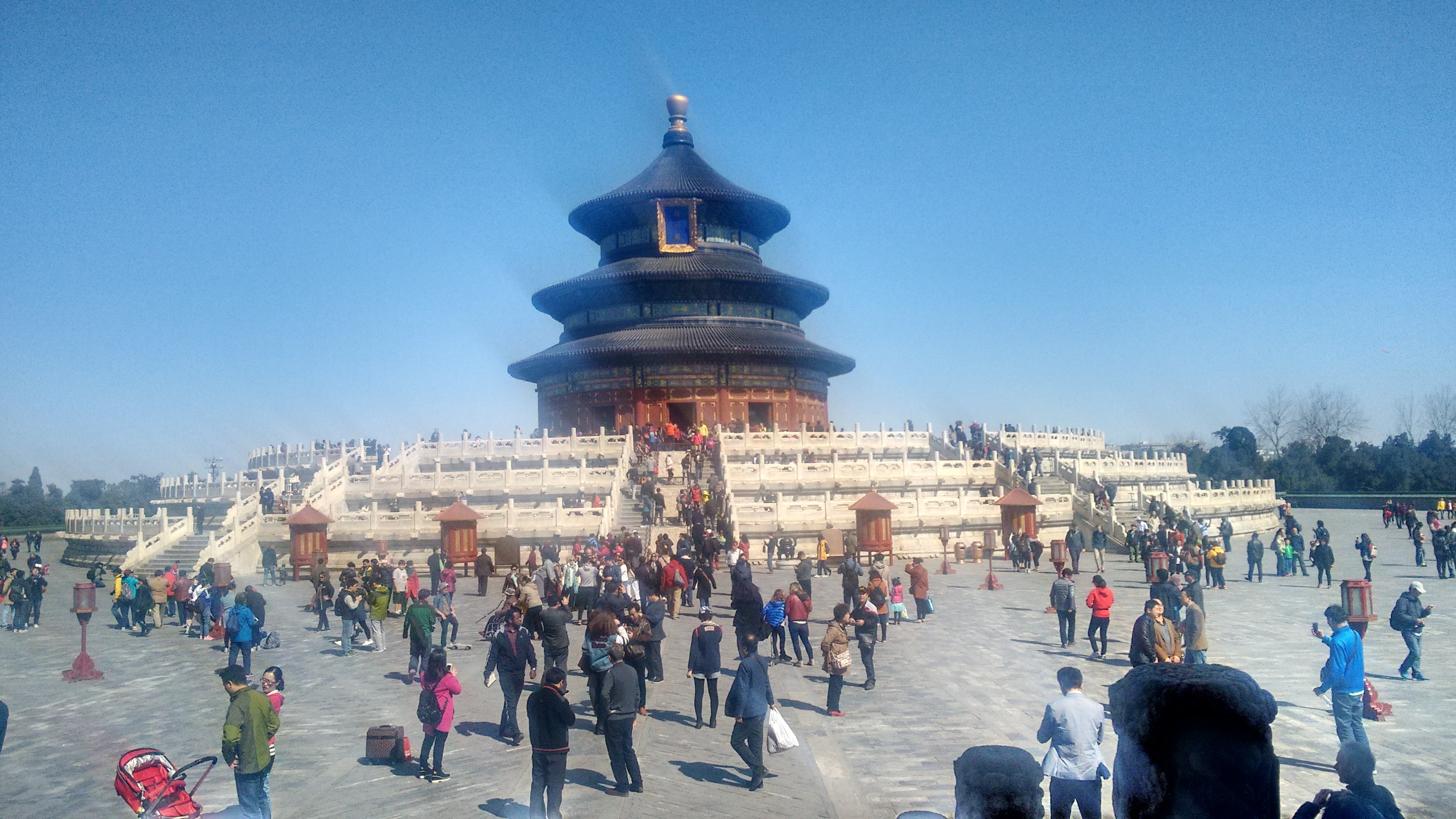 A researcher conducting an ethnographic interview in a modern urban setting in Beijing.