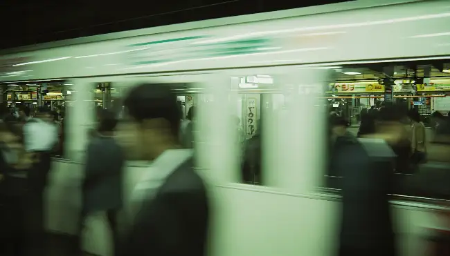 Fast-moving train and people 4