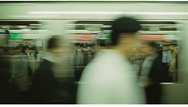 Fast-moving train and people 2