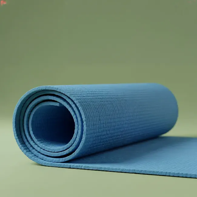 Blue yoga mat on a green background