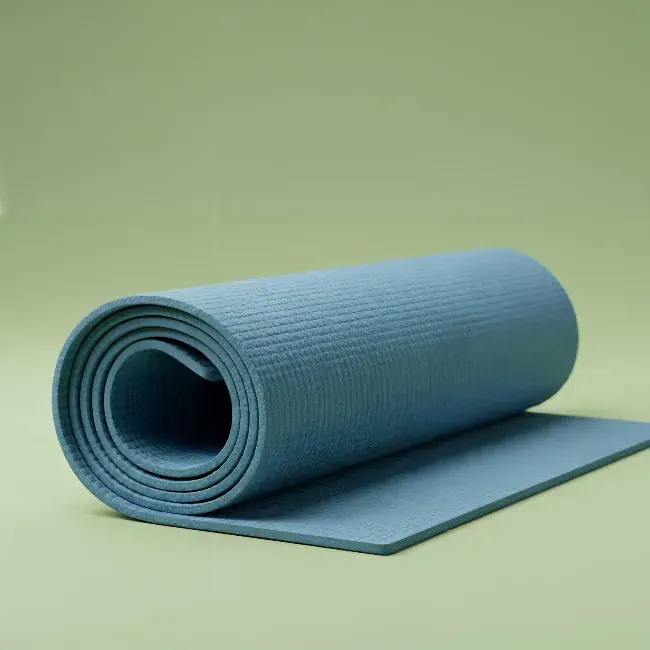 Blue yoga mat on a green background 2