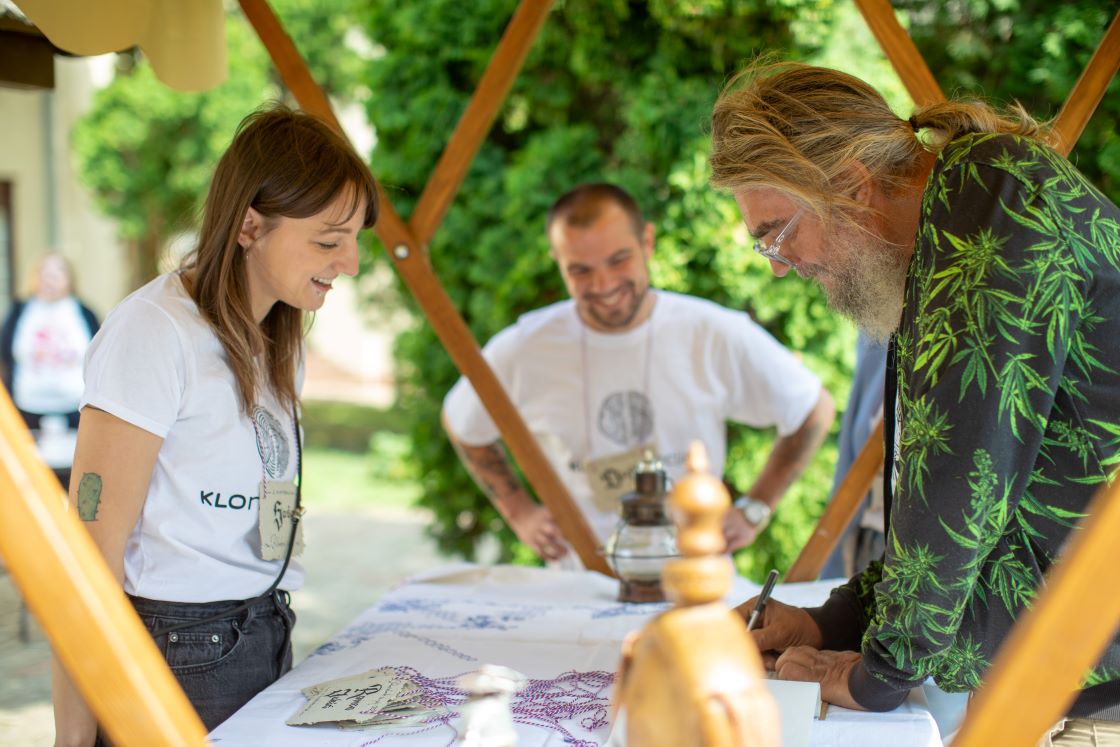 Visitors entering the conference. Our natural accreditations are visible