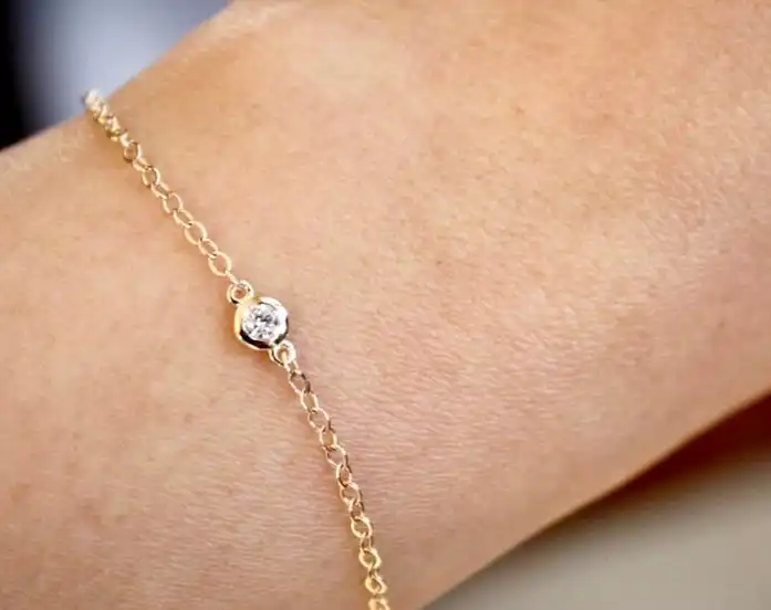 14k gold bracelet with a 1 carat lab grown diamond