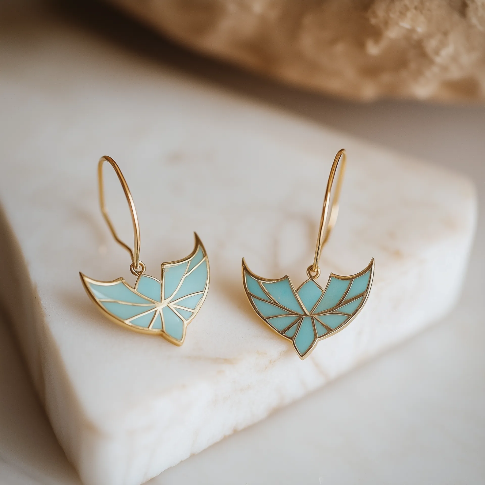 עגילי זהב ״כנפי נפרטיטי״