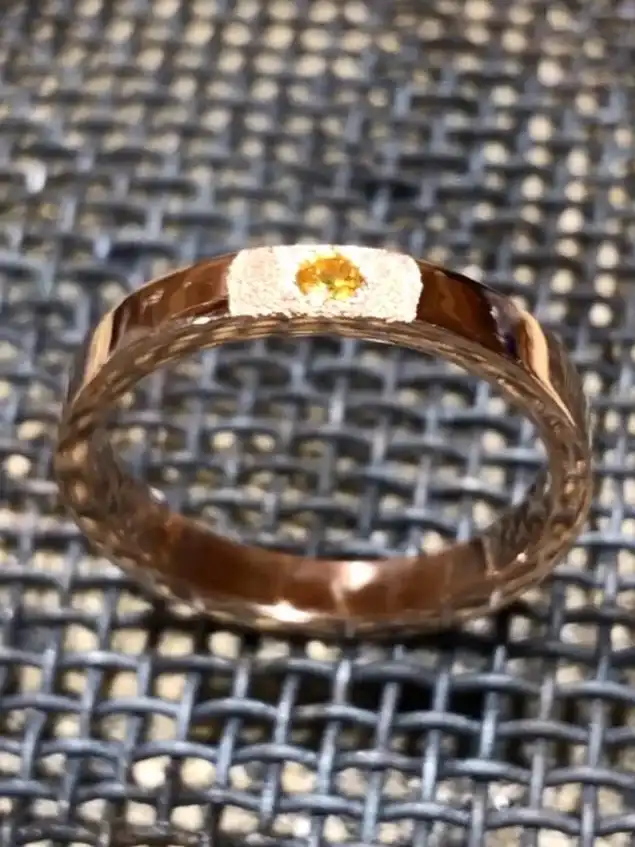 Man rose gold ring with a mat effect and an orange natural diamond on the center