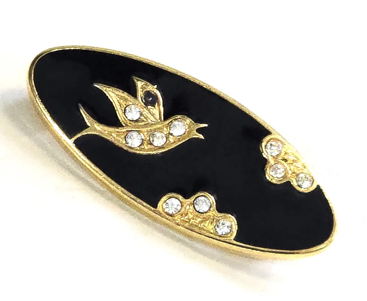 סיכת דש וינט'ג בגוון זהב אם אמייאל שחור ועיצוב ציפןר וענף