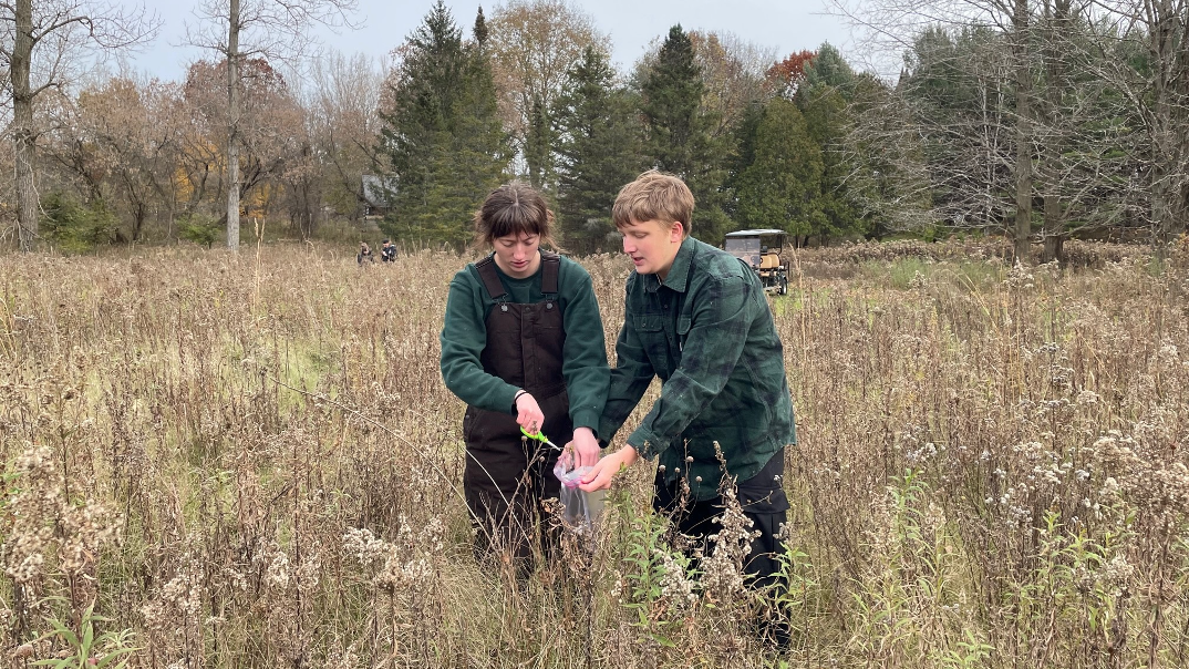 Children studying in rural classroom with volunteer support