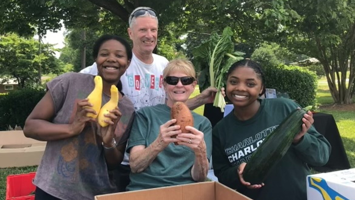 Volunteers collaborating with children