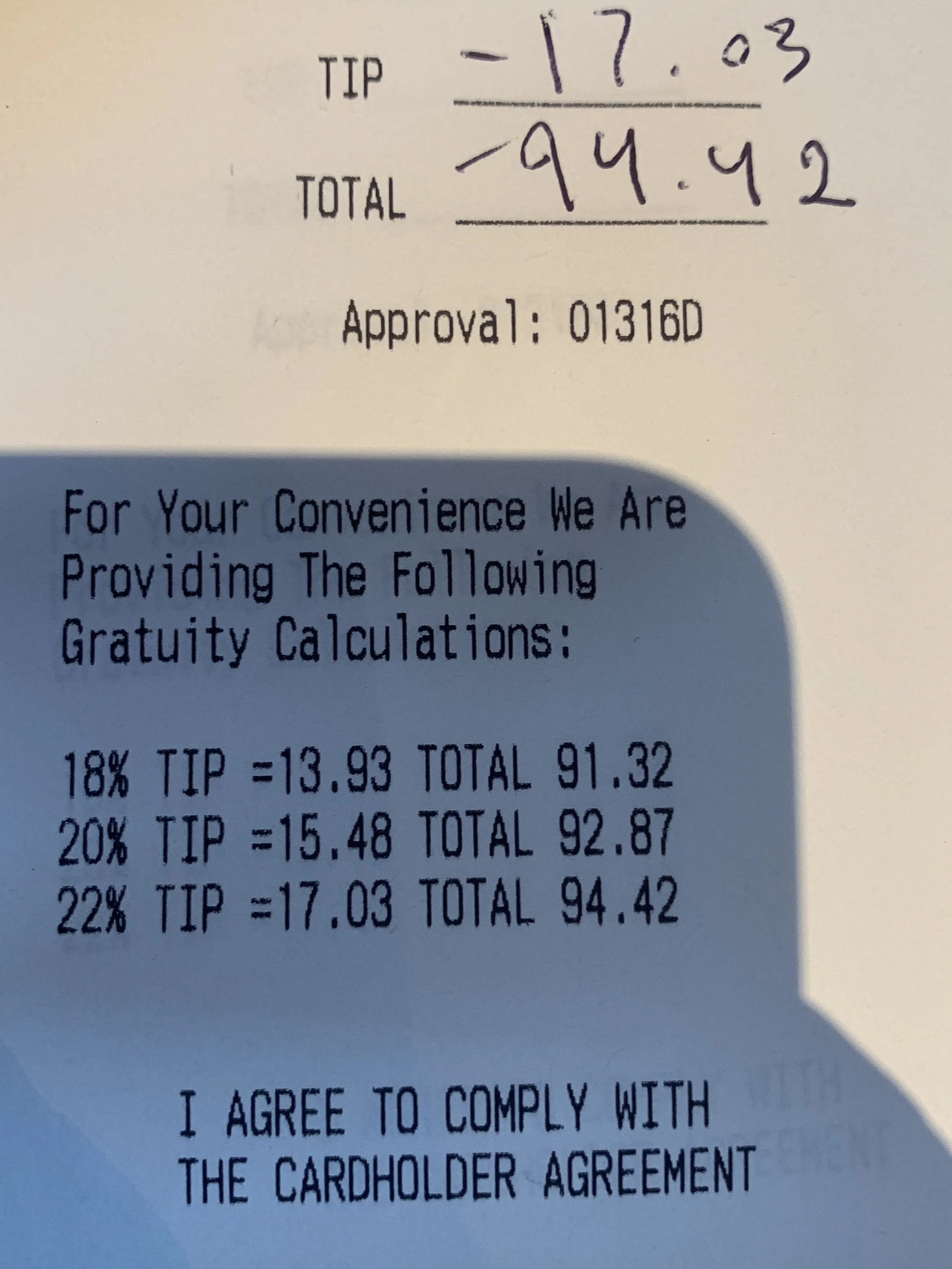 Image taken of a restaurant receipt with a selection of tip options