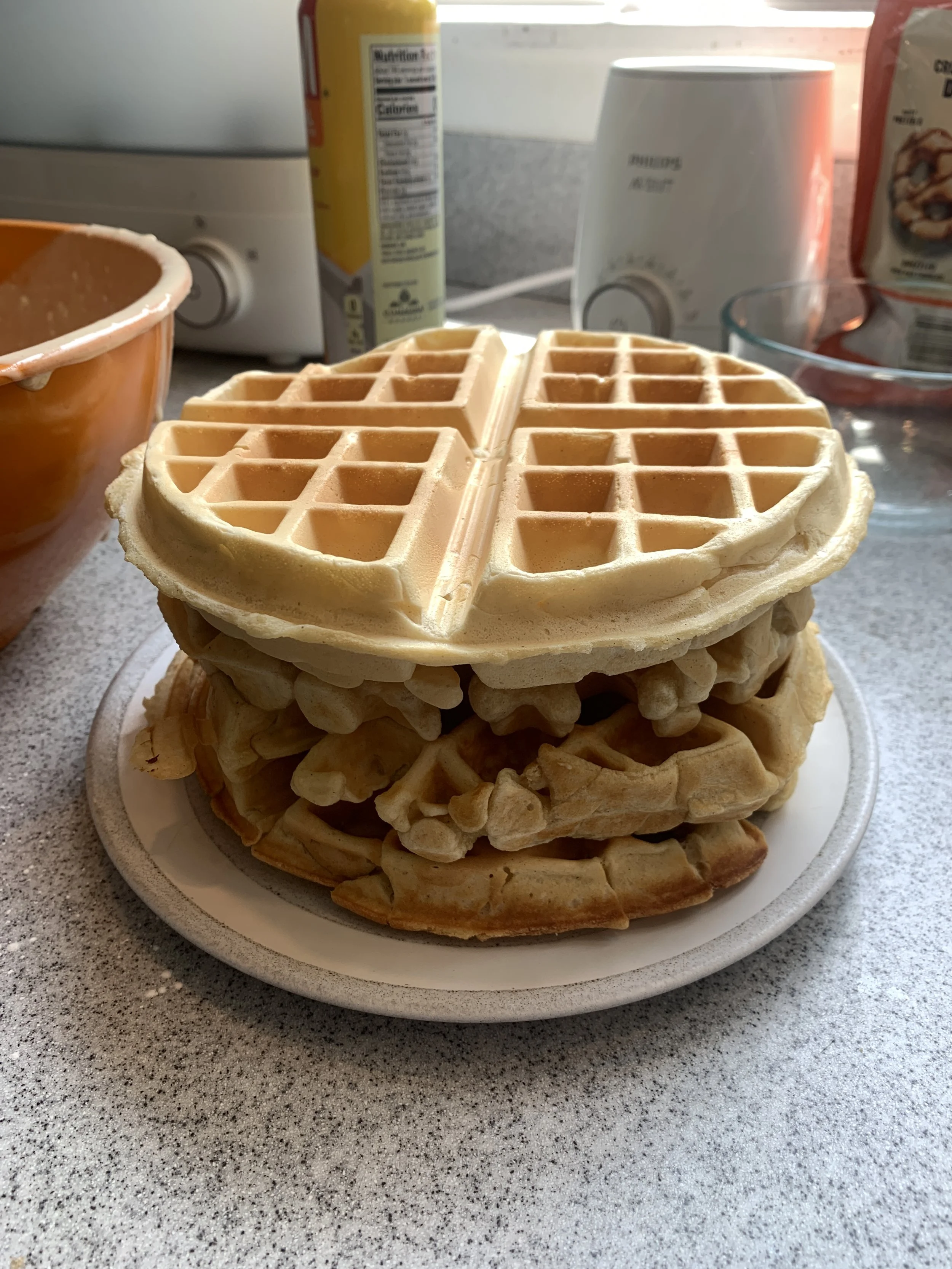  A stack of Belgian waffles with a not-so-good waffle on the bottom and a crisp light and fluffy waffle on the top 