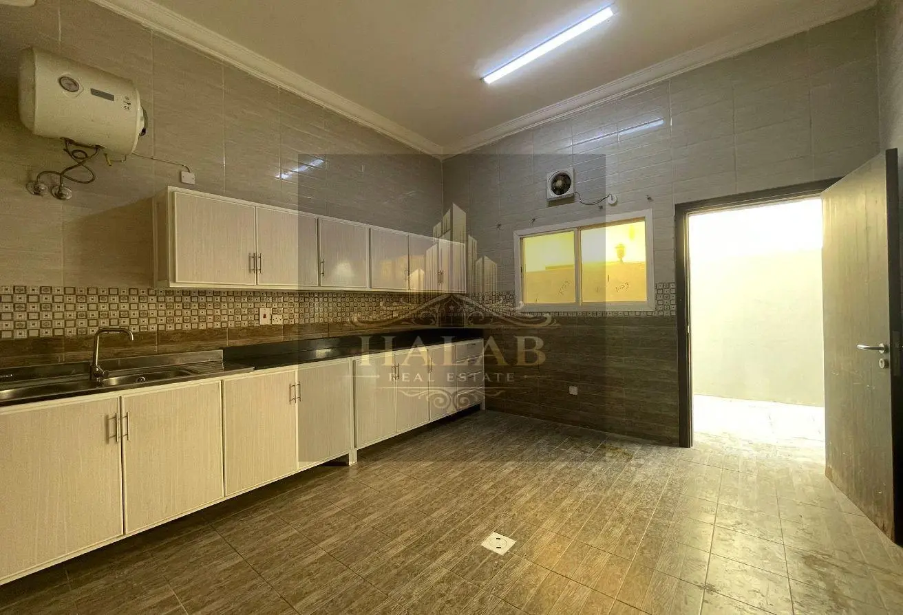 Villas for sale in a compound in Umm Al Amad, near