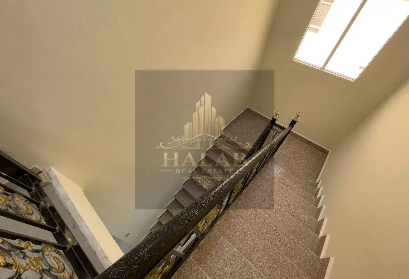 Villas for sale in a compound in Umm Al Amad, near