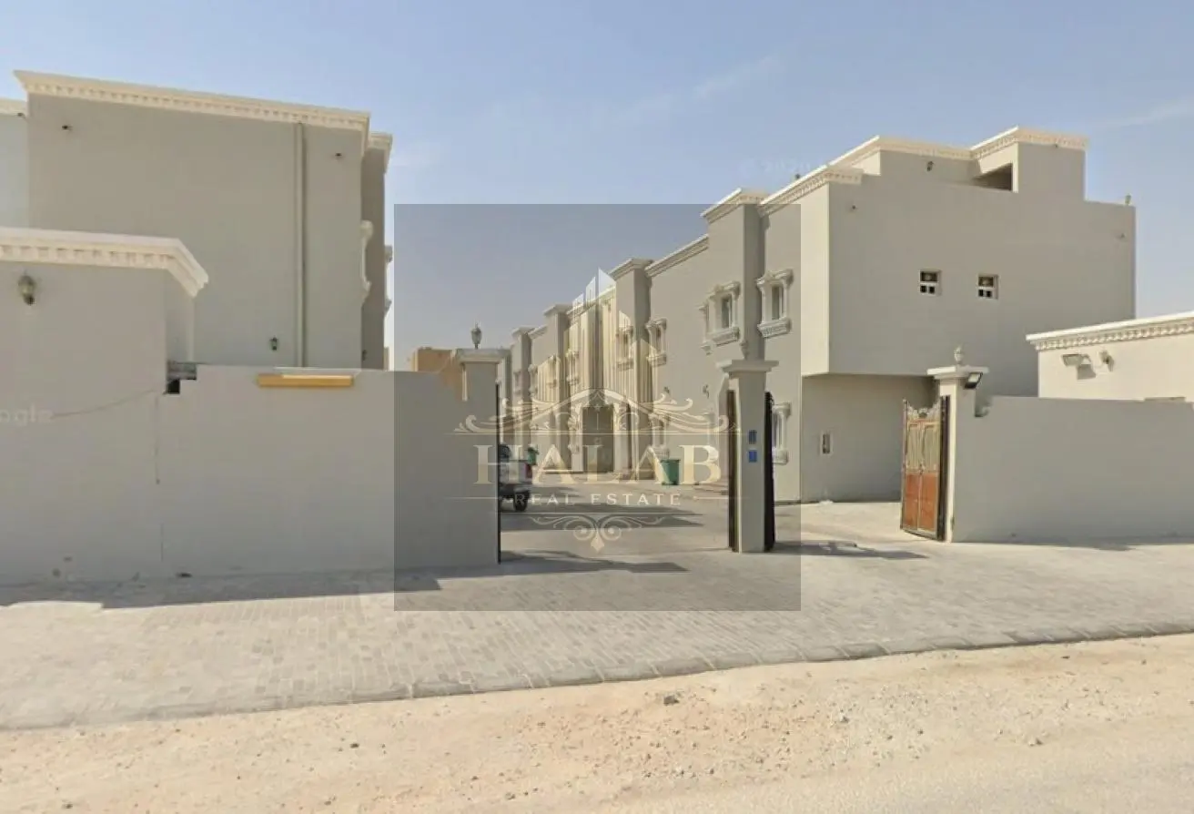 Villas for sale in a compound in Umm Al Amad, near