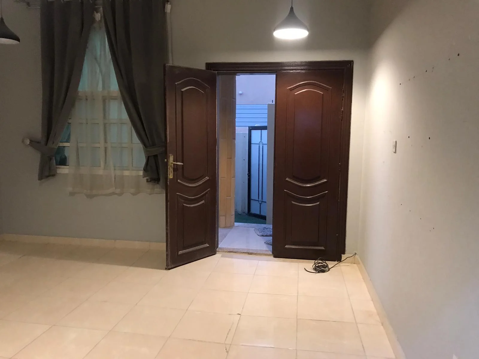 A large room and hall (two rooms, including a corridor), bathroom and comprehensive kitchen with split air conditioner, Al Kharaitiyat, 9-storey villa, ground floor inside the villa, 3300