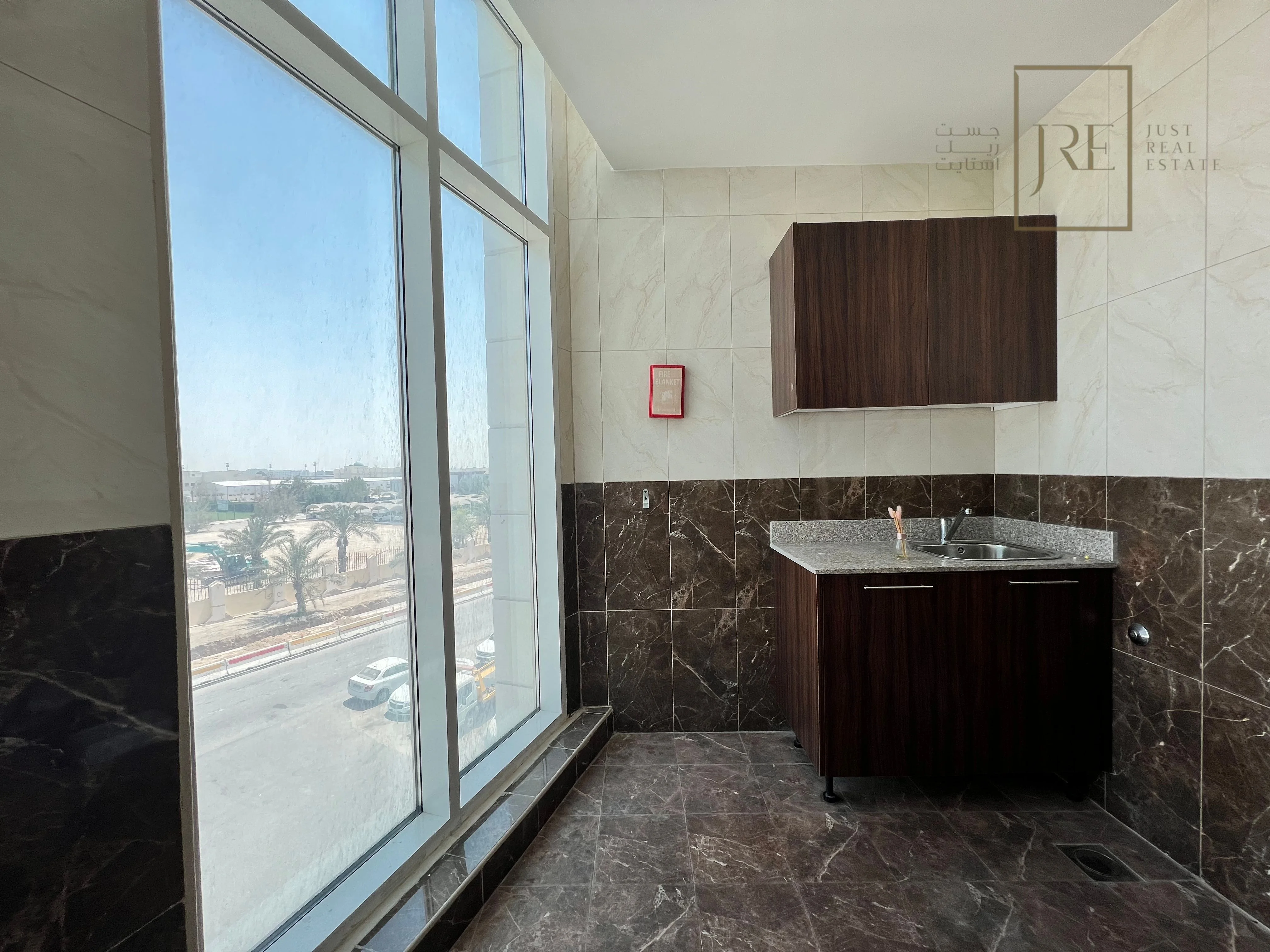 Semi-Fitted Shop Space for Rent in Al Mamoura Plaza | Prime Location + Parking