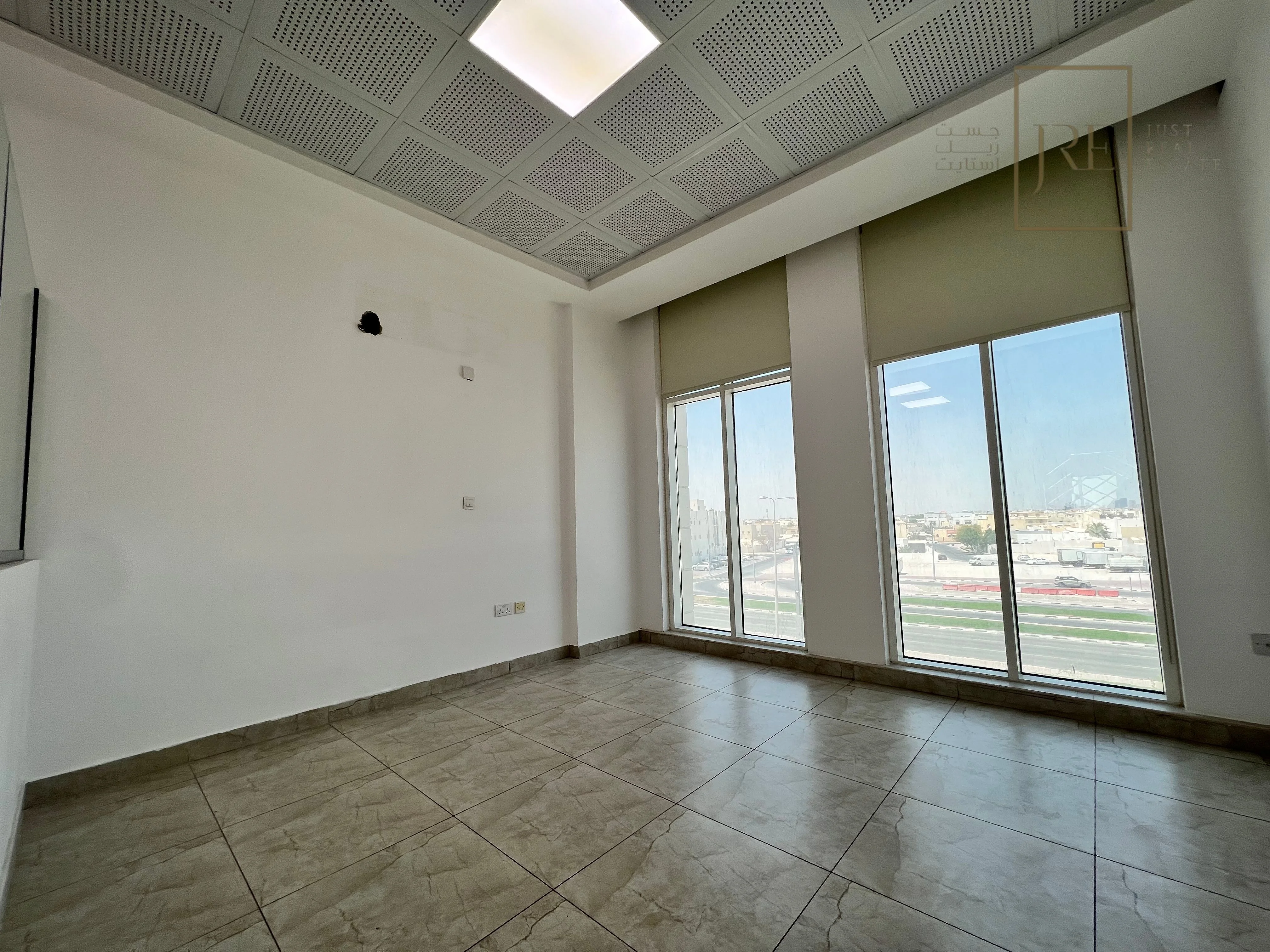 Semi-Fitted Shop Space for Rent in Al Mamoura Plaza | Prime Location + Parking