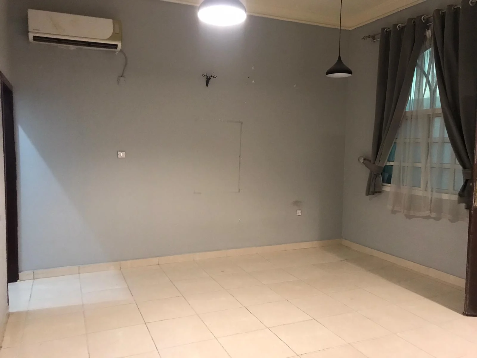 A large room and hall (two rooms, including a corridor), bathroom and comprehensive kitchen with split air conditioner, Al Kharaitiyat, 9-storey villa, ground floor inside the villa, 3300