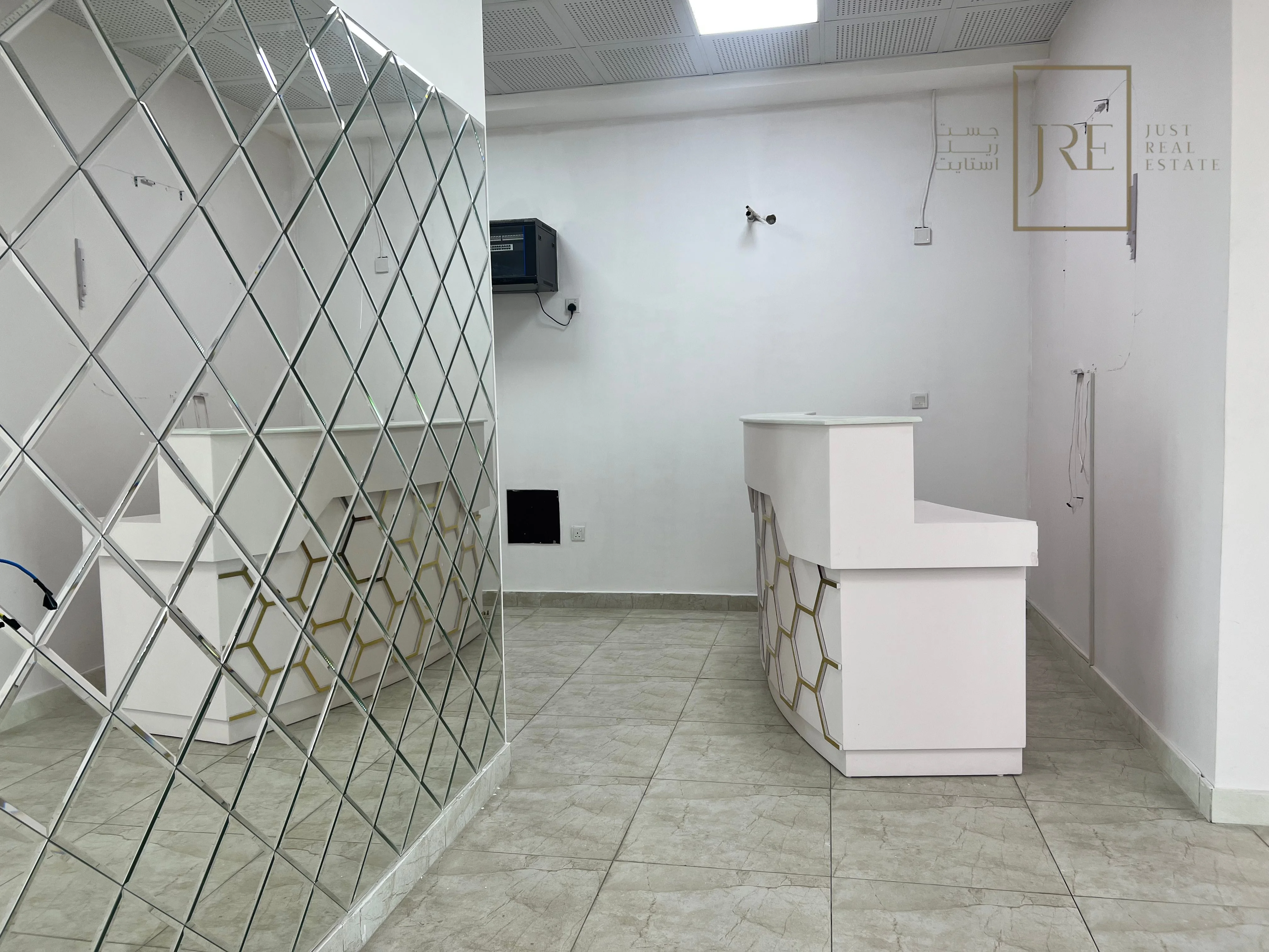 Semi-Fitted Shop Space for Rent in Al Mamoura Plaza | Prime Location + Parking