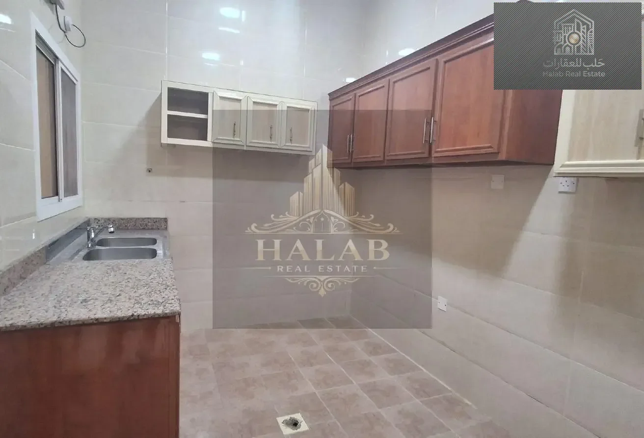 Family 2-Bedroom Apartment with Majlis in Madinat Khalifa Building 58