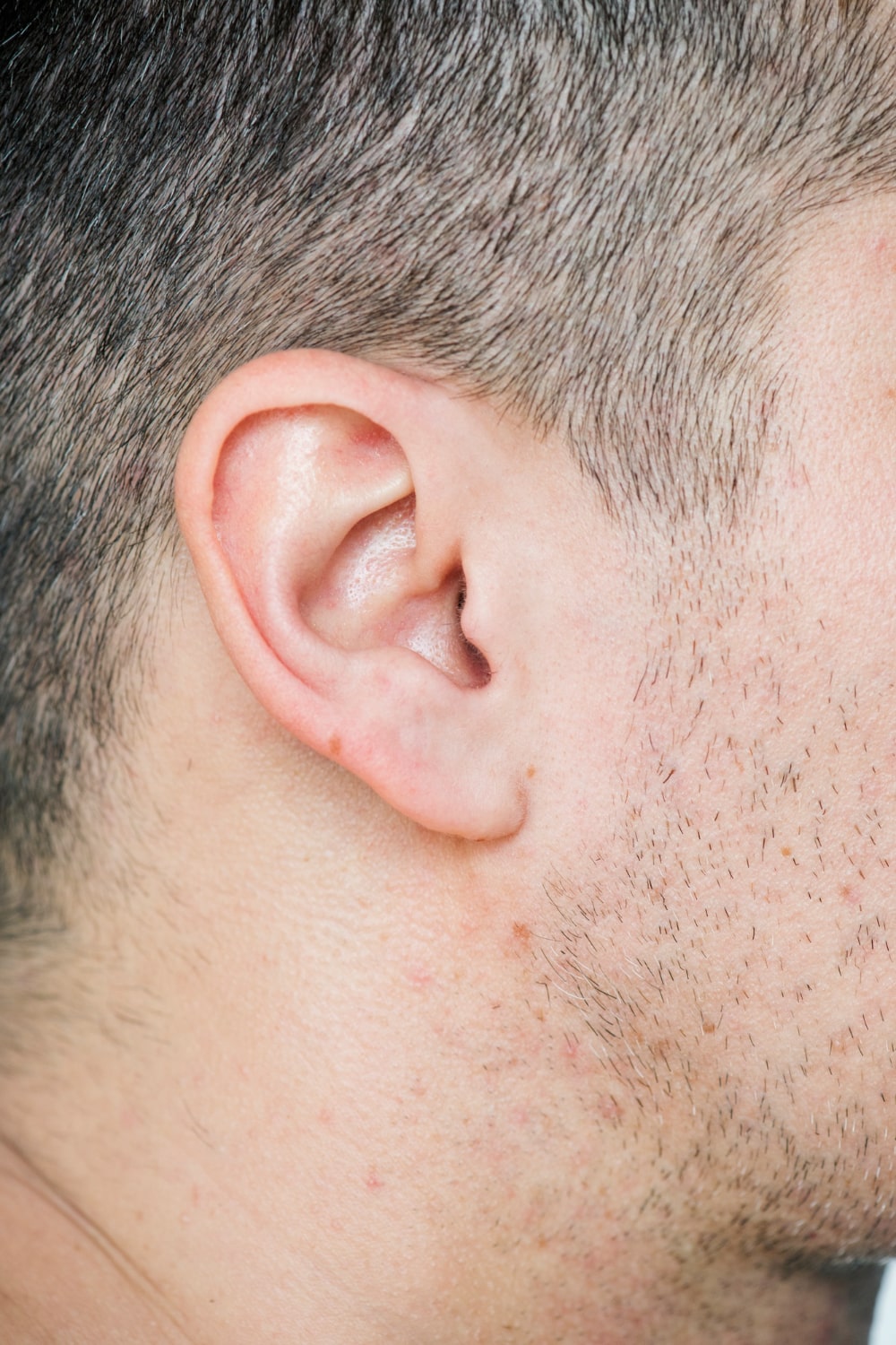 Medical illustration showing inflamed lymph nodes behind the ear.