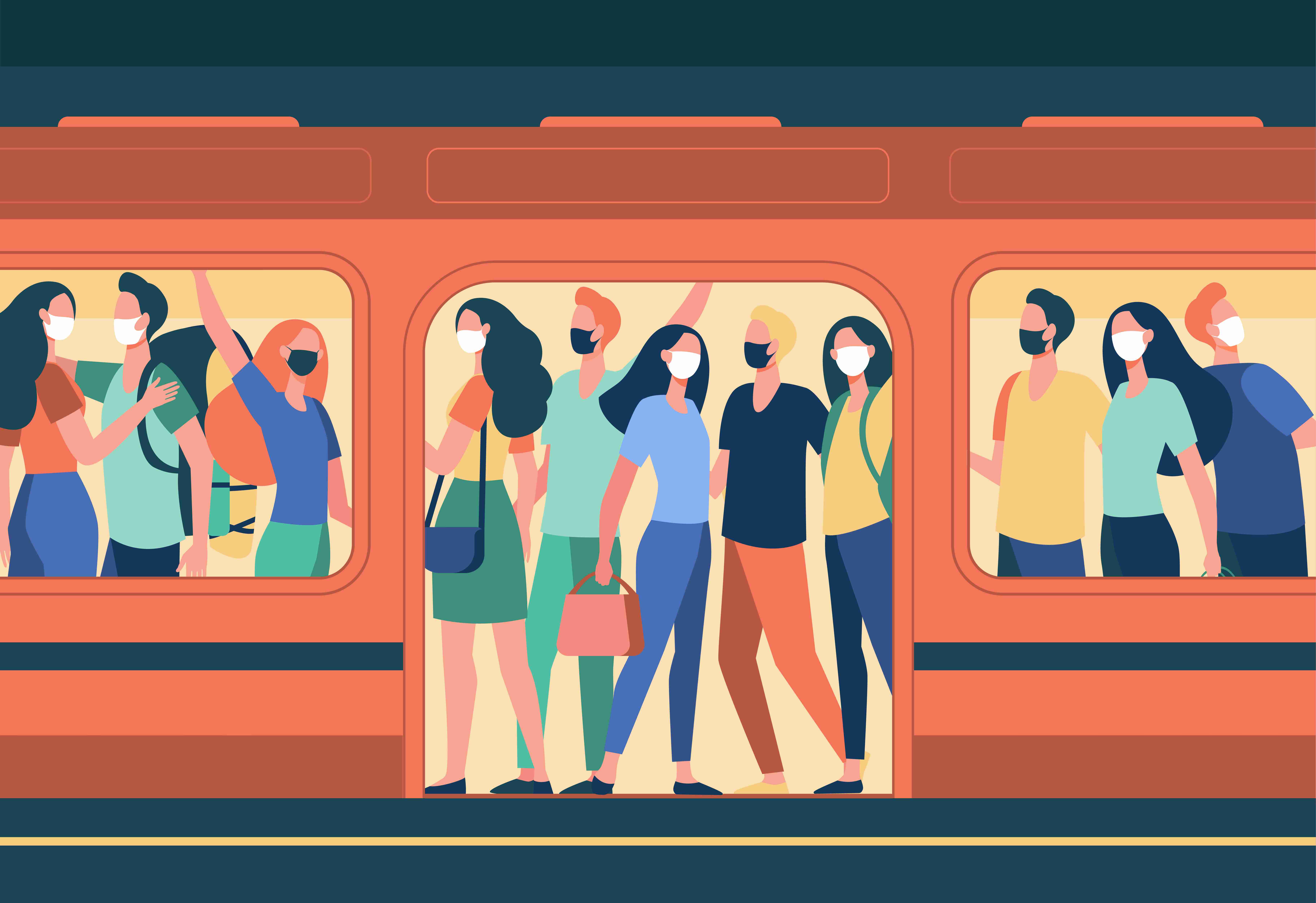 A crowded subway train with several people wearing masks.