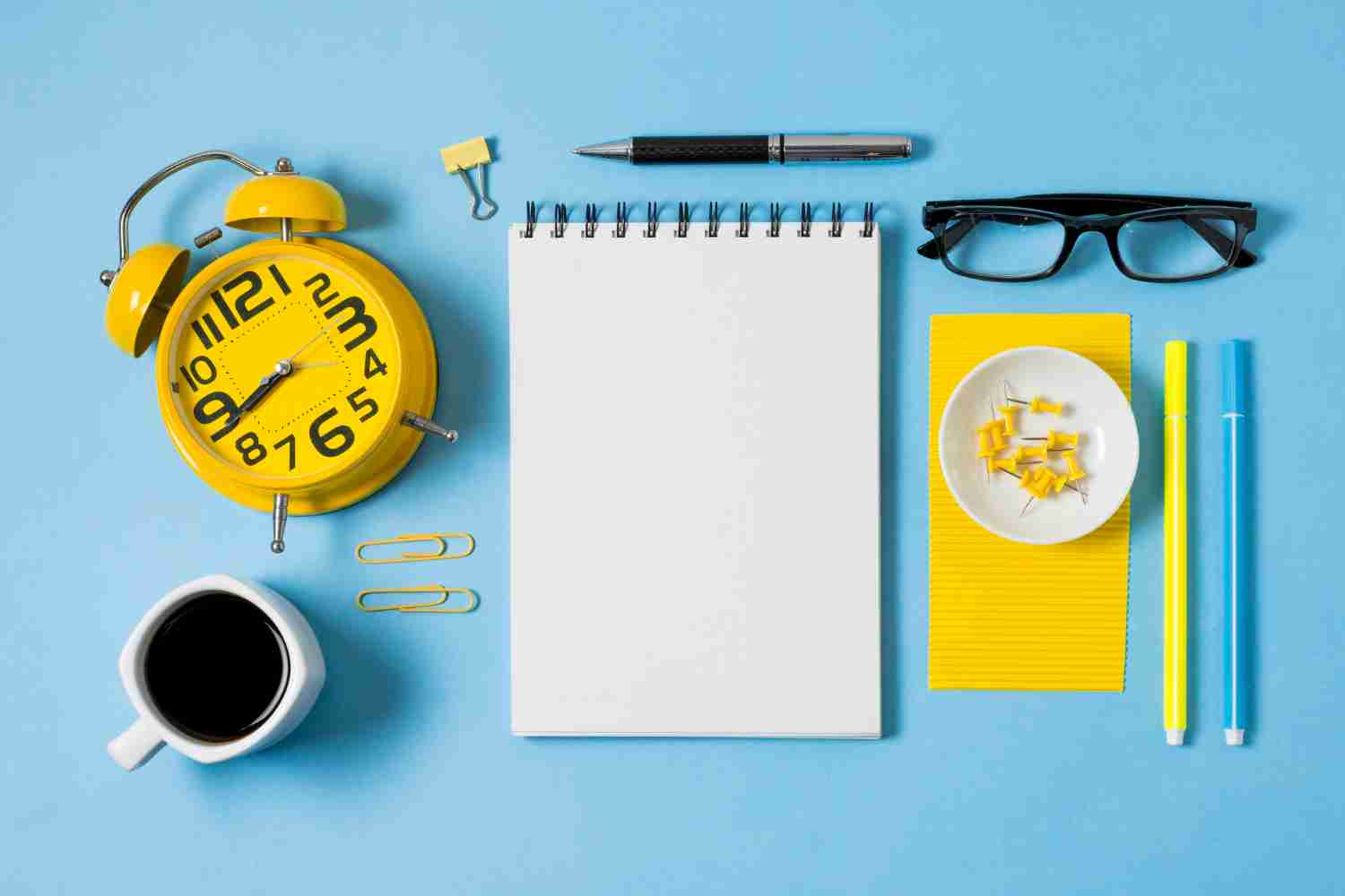 Notebook with terms like “visualization,” “breath control,” and “goal setting” highlighted, next to a stopwatch and whistle.