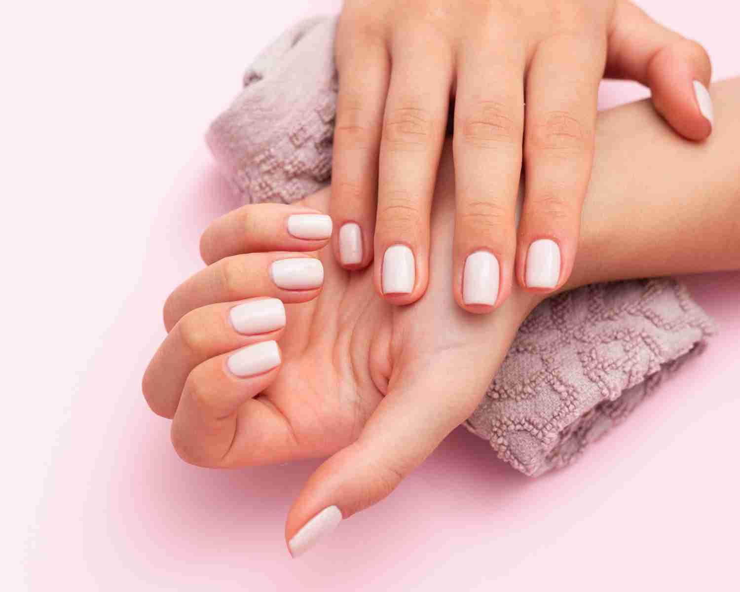 Close-up of spoon-shaped fingernails indicating possible iron deficiency.