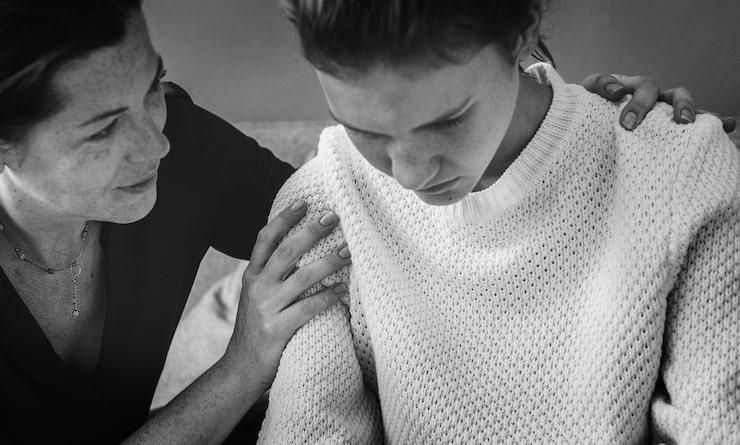 Woman comforting her friend