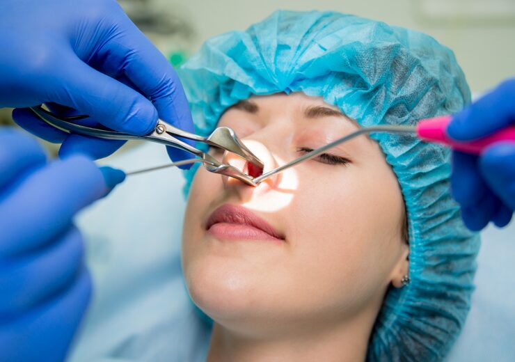 Woman in the middle of medical treatment for her nose