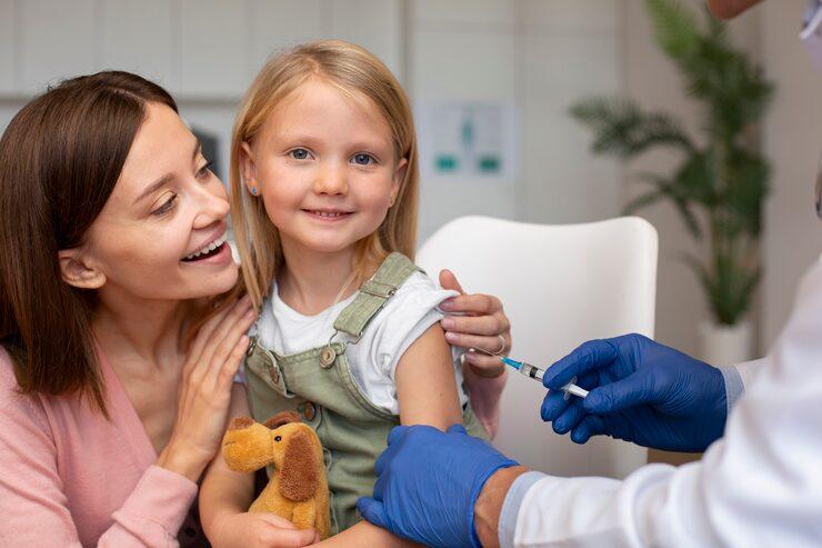 Happy child getting necessary vaccines