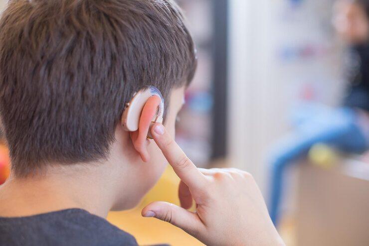 Child wearing a Cochlear Implant