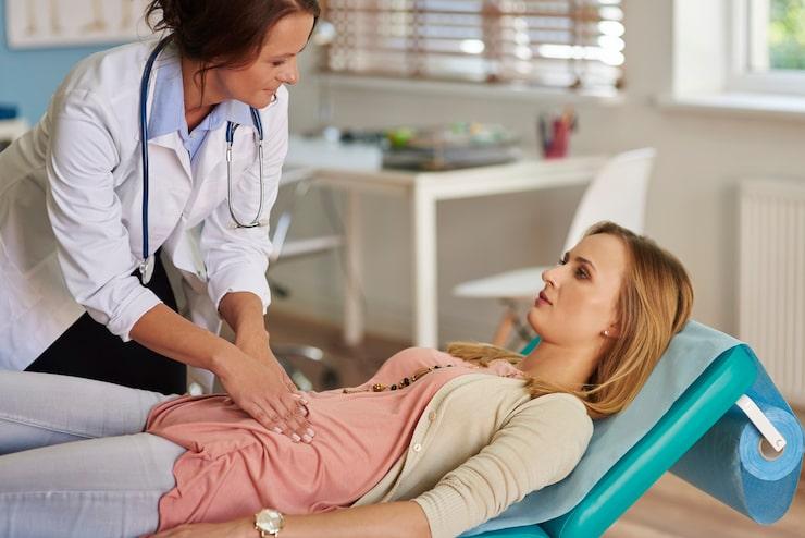 a woman getting a follow up check-up after a pelvic laparoscopy