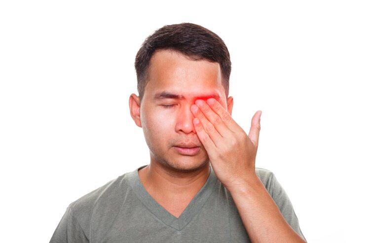 man in distress because of his eye