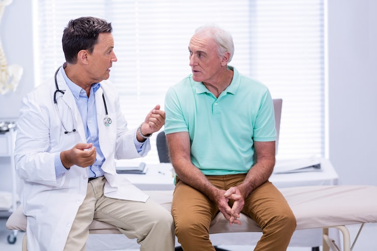 doctor explaining irregular symptoms to his patient