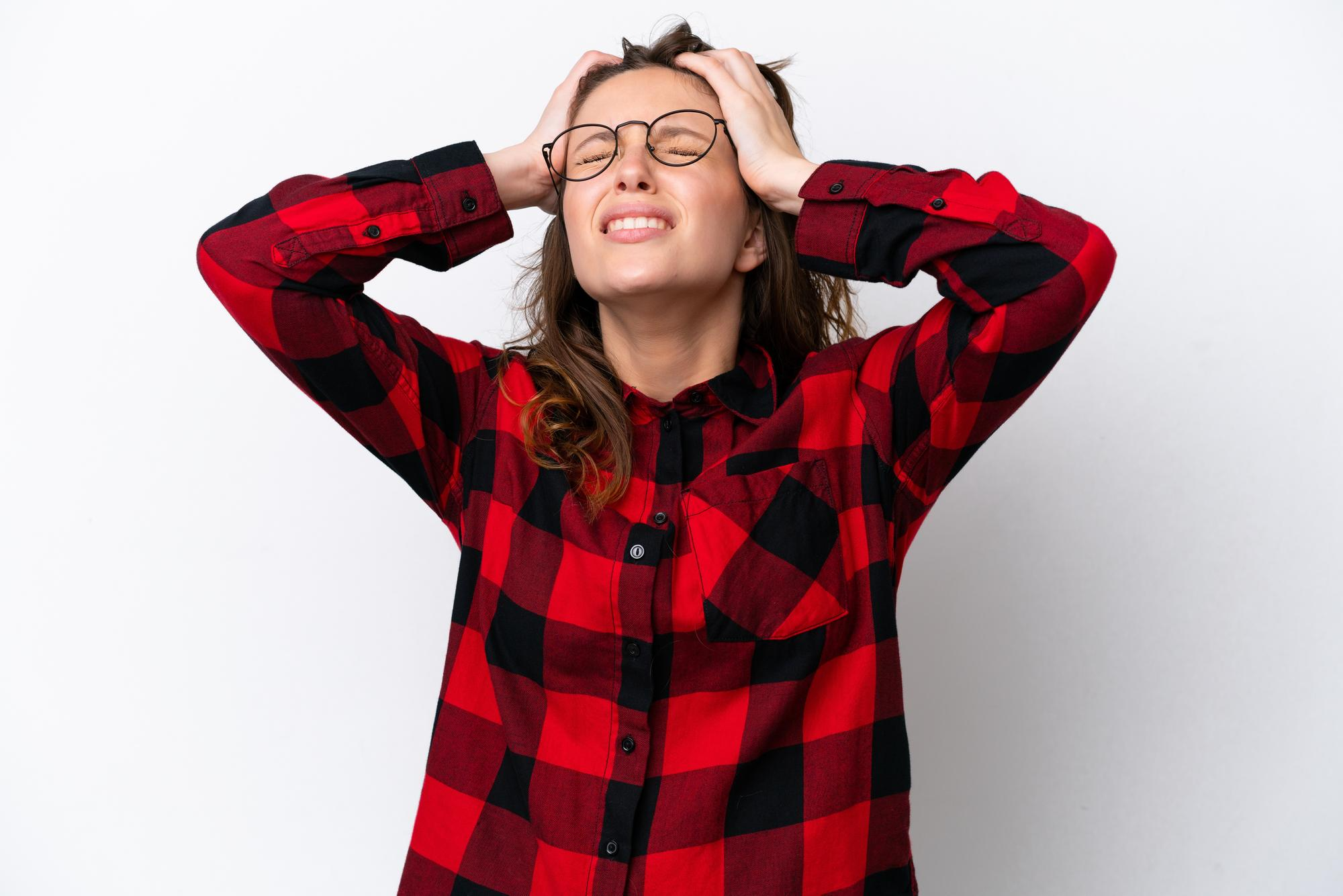 A woman appears visibly irritated and upset, illustrating the common symptoms of mood swings such as sudden irritability, frustration, and emotional changes.
