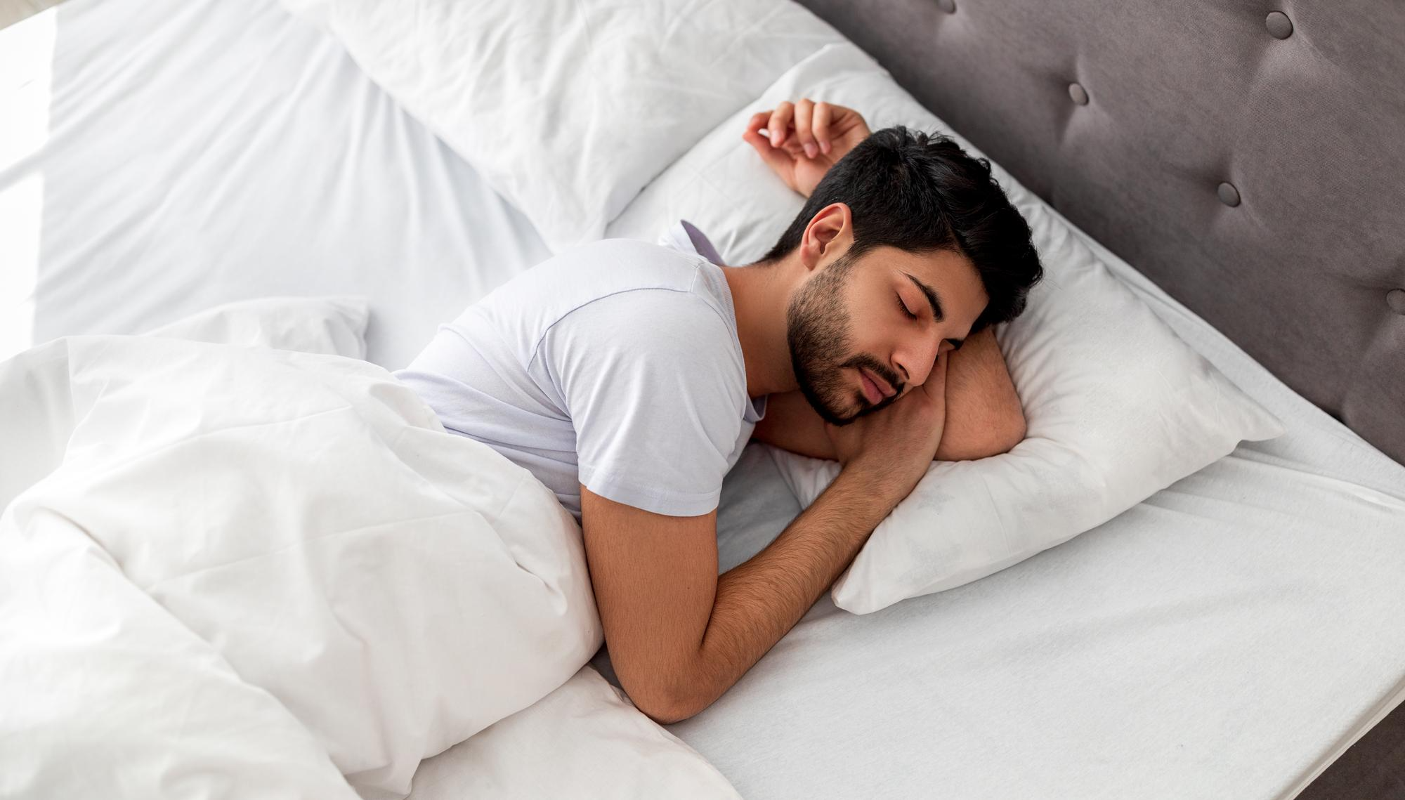 A man sleeping peacefully, showing how good sleep supports a strong immune system.